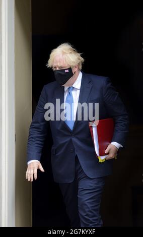 British Prime Minister Boris Johnson leaving 10 Downing Street for the Houses of Parliament. 14th July 2021. Stock Photo