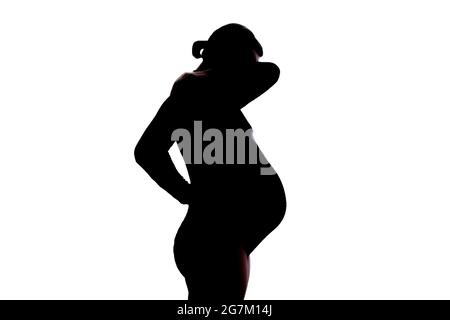 Pregnant woman standing with a pain in the neck Stock Photo