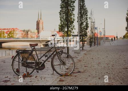 Bicycle on a city street. City bicycle, retro cycling in town, old retro bike, cycling or commuting in city urban environment, ecological transportati Stock Photo