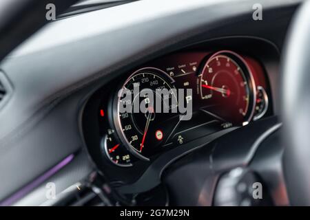 Modern car dashboard. New car interior details. Speedometer and tachometer. Selective focus Stock Photo
