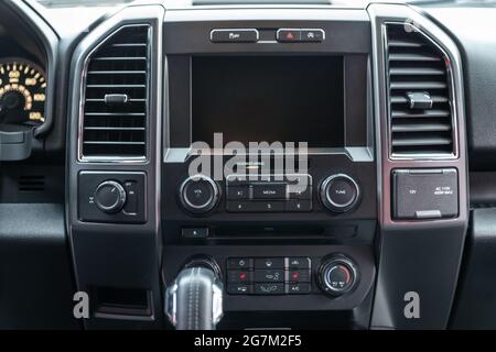 Modern car interior with multimedia display and dashboard. View from inside a car. Stock Photo