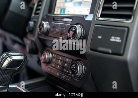 Luxury car Interior - multimedia display, shift lever and dashboard. Interior detail of new modern car Stock Photo