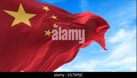 The national flag of People's Republic of China flying in the wind. Outdoors and sky in the background. Stock Photo