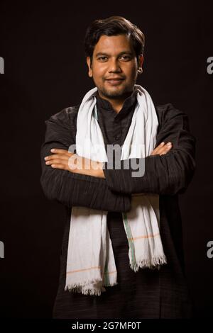 PORTRAIT OF A RURAL MAN STANDING CONFIDENTLY IN FRONT OF CAMERA Stock Photo