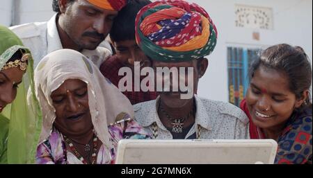 Indian family having a video call with a relative Stock Photo