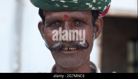 Portrait of an Indian old man with headwear and mustache Stock Photo
