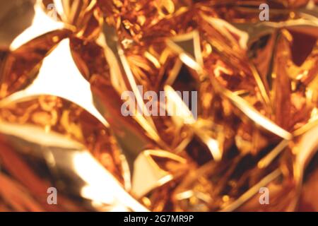 Blurred golden foil shiny texture. Soft focus background. Stock Photo