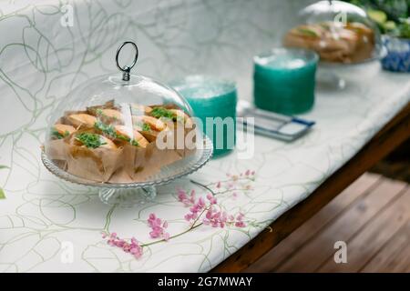 A group of homemade HAMBURGER is wrapped with paper craft and arranged on the dish, ready to serve and eat. Stock Photo