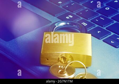 Padlock on a keyboard as a symbolic image for internet security, hacker attacks and so on Stock Photo