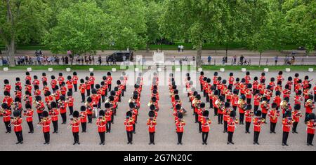 Wellington Barracks, London, UK. 15 July 2021. Bands of the Household Division give a taste of the programme from the military musical spectacular, The Sword & The Crown, due to take place on evenings of 20/21/22 July on historic Horse Guards Parade. The preview takes on the parade ground of Wellington Barracks with bands of the Grenadier, Coldstream, Scots, Irish and Welsh Guards and representatives from 1st Battalion Grenadier Corps of Drums. Credit: Malcolm Park/Alamy Live News Stock Photo