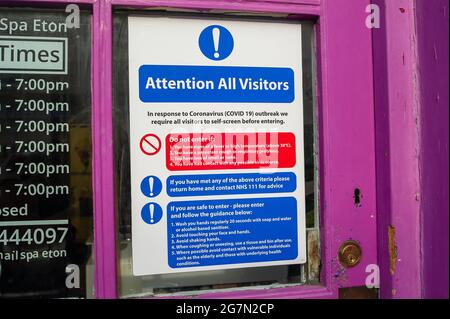 Eton, Windsor, Berkshire, UK. 14th July, 2021. A Covid-19 notice in a nail bar window in Eton High Street. Following the announcement by Boris Johnson that the Covid-19 lockdown is ending in England from Monday 19th July, 2021, over a thousand scientists and doctors are reported to be very concerned about people no longer having to legally adhere to Covid-19 prevention measures. Credit: Maureen McLean/Alamy Stock Photo