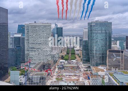 Paris, France - 07 14 2021: Air show of July 14. Alphajet of the patrol of France flying between buildings Stock Photo