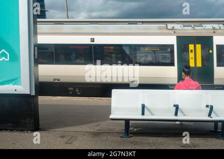 Girl on train platform, Clapham Junction,London, England Stock Photo