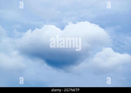 Amazing Natural Heart Shape Cumulus Cloud Floating on the Sky Stock Photo