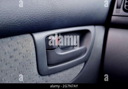 Closeup of modern car's inner door handle Stock Photo
