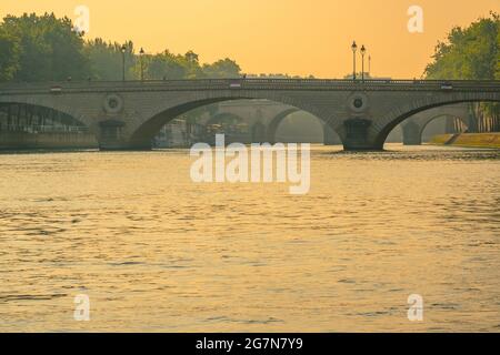 France. Stone bridges over the river Seine in Paris and golden sunset Stock Photo