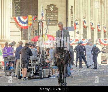 Glasgow, Scotland, UK,  15th  July, 2021.Indiana jones filming continued today as traffic restrictions start from  in the city centre and the shop fronts and decorations are finished as locals  as the astronaut paraddecame along st vincent street with indiana jones astride a horse . A hot day under nder a well guarded set. Credit Gerard Ferry/Alamy Live  News Stock Photo