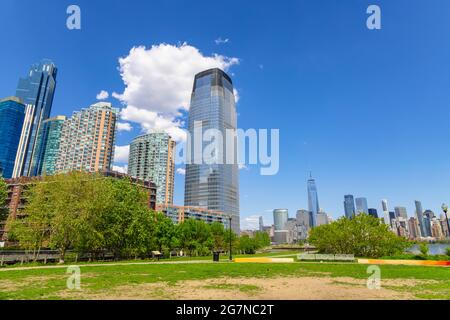 Clouds float over the Luxury high-rise apartments in Jersey City New Jersey. Stock Photo