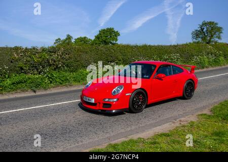 2007 red Porsche 3284cc 2dr petrol Coupe, en-route to Capesthorne Hall classic May car show, Cheshire, UK Stock Photo