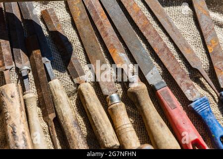 Old rusty files side by side in outdoor sun in Lammi Finland Stock Photo