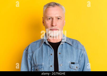 Photo of confident old man wear jeans blazer isolated on vibrant yellow color background Stock Photo