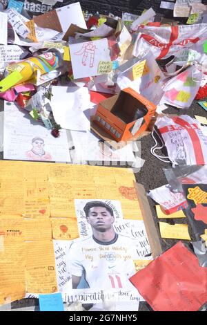 Close up of a small part of the giant Manchester United player Marcus  Rashford mural in Withington, Manchester, England, United Kingdom, that was  vandalised with abusive graffiti after England's Euro2020 football loss