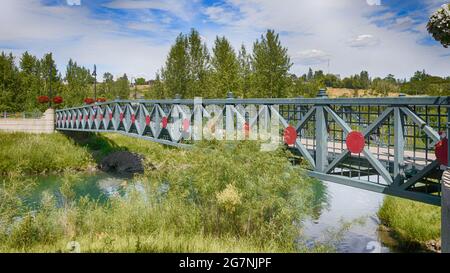 Pedestrian bridge on the Bow River in Princes Island Park, Calgary, Canada Stock Photo