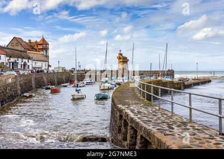 Lynmouth harbour at high tide with the Rhenish Tower on the harbour wall, North Devon, England. Stock Photo