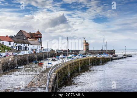 Lynmouth harbour at high tide with the Rhenish Tower on the harbour wall, North Devon, England. Stock Photo