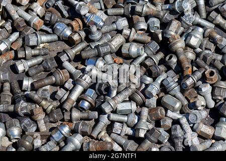 Large pile of silver metal screws used in transport industry Stock Photo