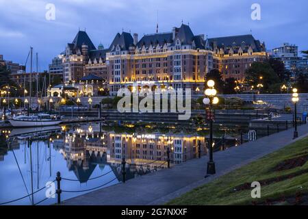 Beautiful view Victoria Harbor and the Empress Hotel with lit lights in British Columbia, Canada Stock Photo