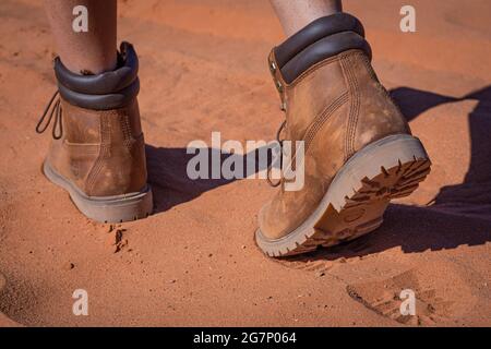 An adventurer leaves her footprints in the sand Stock Photo
