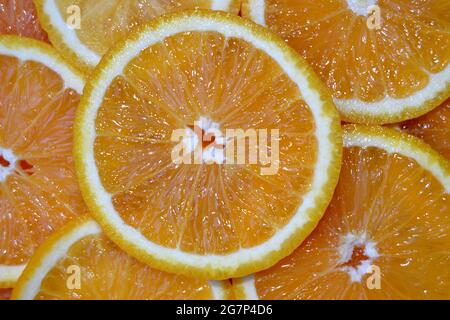 Abstract background with citrus fruit of orange slices. Close up. Studio photography. Stock Photo