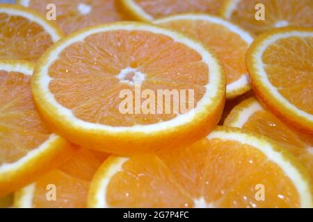 Abstract background with citrus fruit of orange slices. Close up. Studio photography. Soft focus Stock Photo