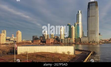 Aerial of Goldman Sachs building and the gold coast skyscrapers, with Jersey City 911 Memorial in the foreground at Liberty State Park. Stock Photo