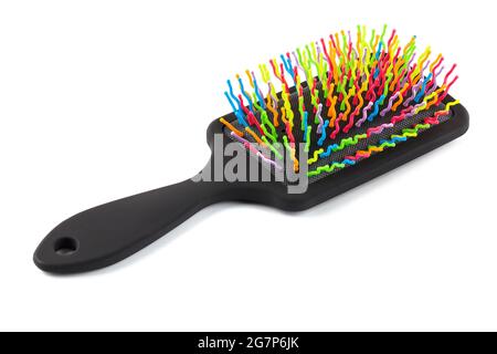 new rainbow colorful pastic hair brush isolated on white background. Stock Photo