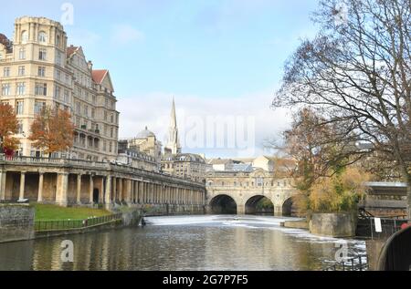 The Empire Hotel overlooks the river Avon in the centre of Bath with the spire of St Michaels church visible behind the Pulteney bridge.Somerset. UK Stock Photo