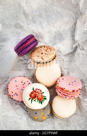 Colorful french macarons on gray background.  Pastel colors. Top view. Stock Photo