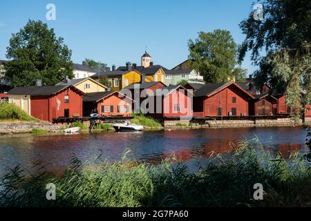 Old wooden storage buildings on Porvoonjoki riverbank in old town of Porvoo, Finland Stock Photo