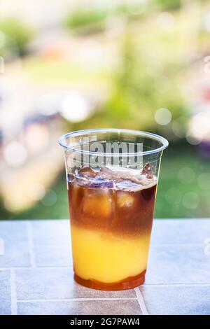 Bumble coffee - refreshment summer iced cocktail with espresso, orange juice, caramel syrup and ice Stock Photo