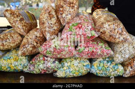Bags of candy and caramel popcorn in plastic bags for sale at a farmers market in St. Albert, Alberta, Canada Stock Photo