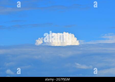 Cloud formation in full sunlight passing over the Ozark Mountains Stock Photo
