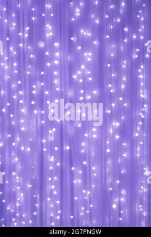 photo of blurred bright small light bulb with purple color scene for background Stock Photo