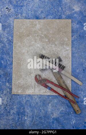 Bronze casting process and manual labor concept. Stock Photo