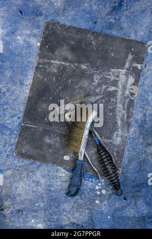 Bronze casting process and manual labor concept. Stock Photo