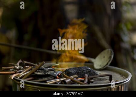 Bronze casting process and manual labor concept. Stock Photo