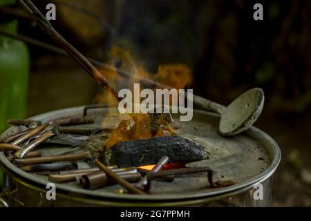 Bronze casting process and manual labor concept. Stock Photo