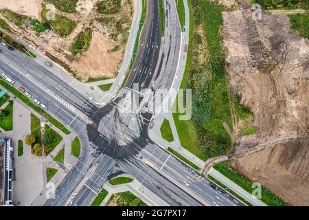 Spring Road Intersection Background Aerial view of the intersection of asphalt and ground roads in the ...