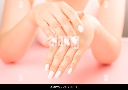 beautiful and well-groomed hands of an adult female hand. middle aged Female Palm. Hygiene and care for hands. Beauty industry concept. Professional m Stock Photo