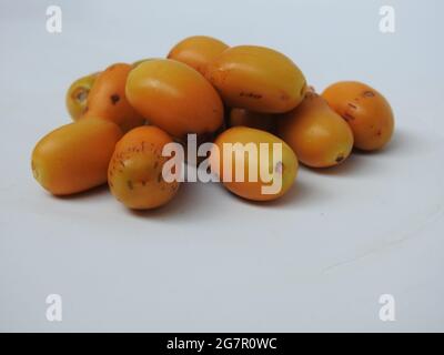 Raw Zehidi Dates with seeds isolated on white background Stock Photo